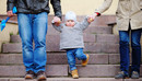 outdoors, girl, people, person, young, park, love, parent, father, family, mother, lifestyle, woman, day, man, boy, city, town, urban, support, happy, holding, hands, walking, child, steps, stairs, aged, playing, development, little, foot, son, european, jeans, three, kid, baby, together, parenting, parenthood, legs, offspring, toddler, cone, grandson, teaching, grandparents, stride, going