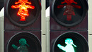 Fußgängerampel zeigt Ampelsignale als Frauenumrisse in Rot und Grün